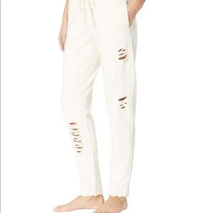 Alo ripped sweatpants in gray/off white